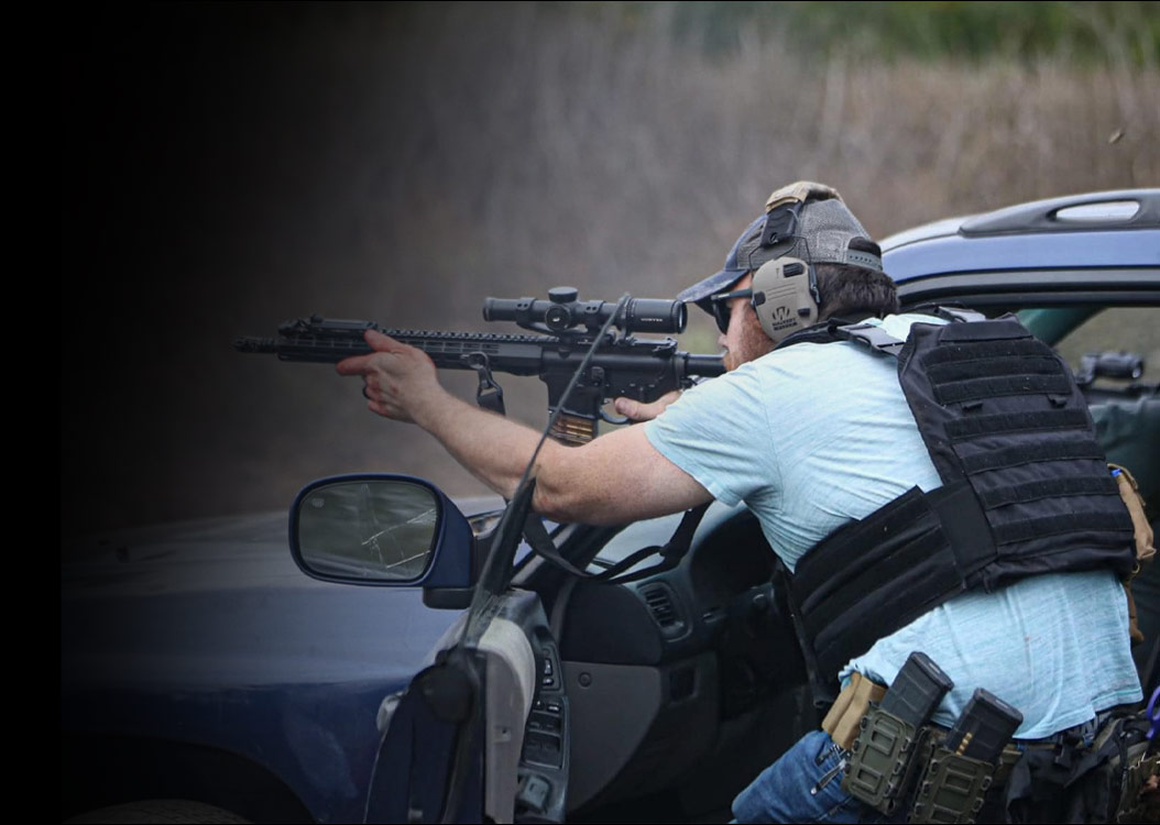 Student working through urban combat carbine drill on range