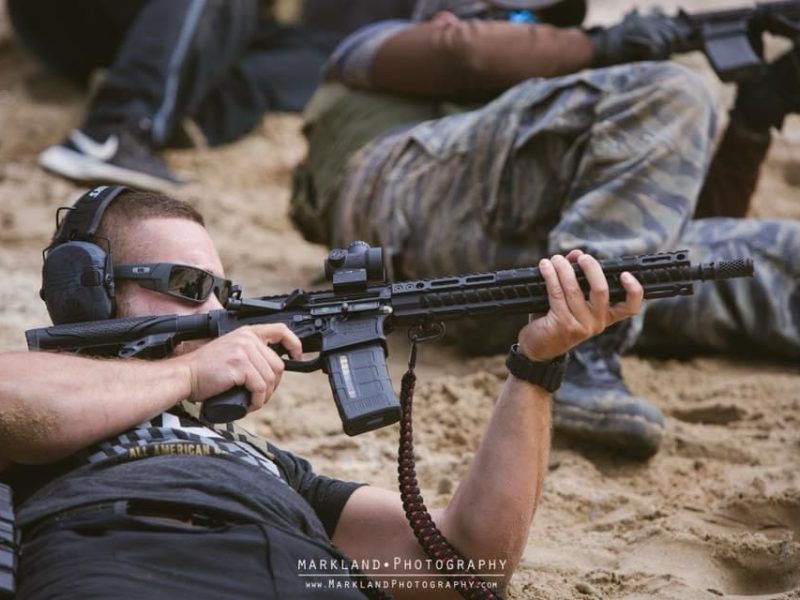 student firing AR15 during beginner carbine training course